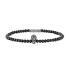 Onyx Bead Stretch Bracelet With Black Spinel Skull
